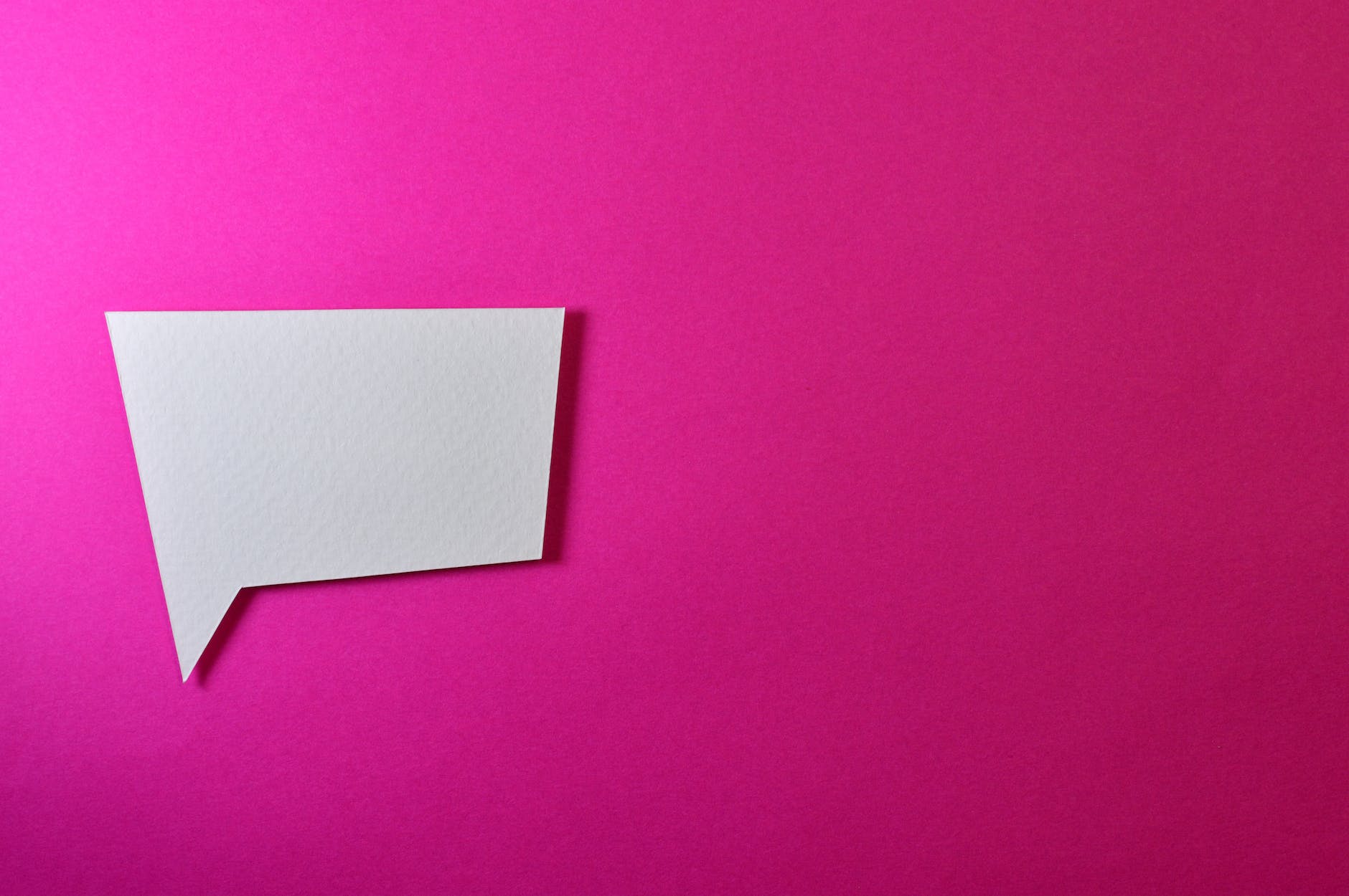 white chat logo on pink background